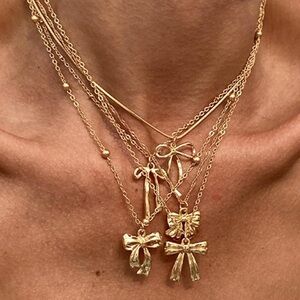 Anthropologie Gold Bow Charm Necklace Collection Set